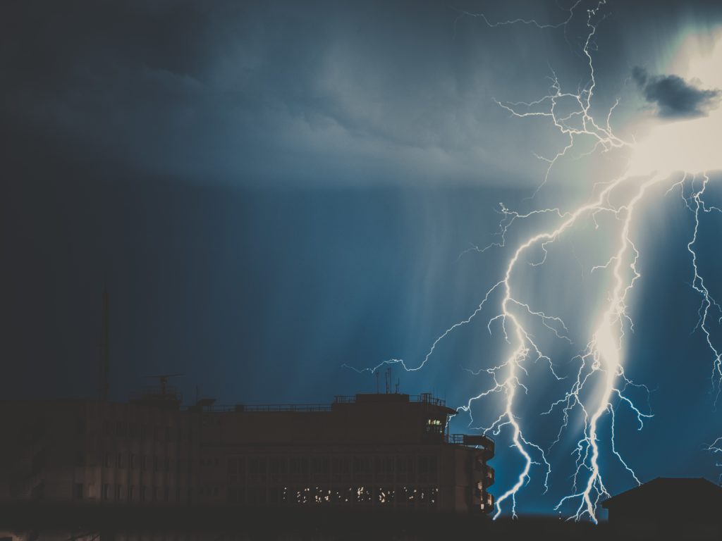 Lightning striking building.