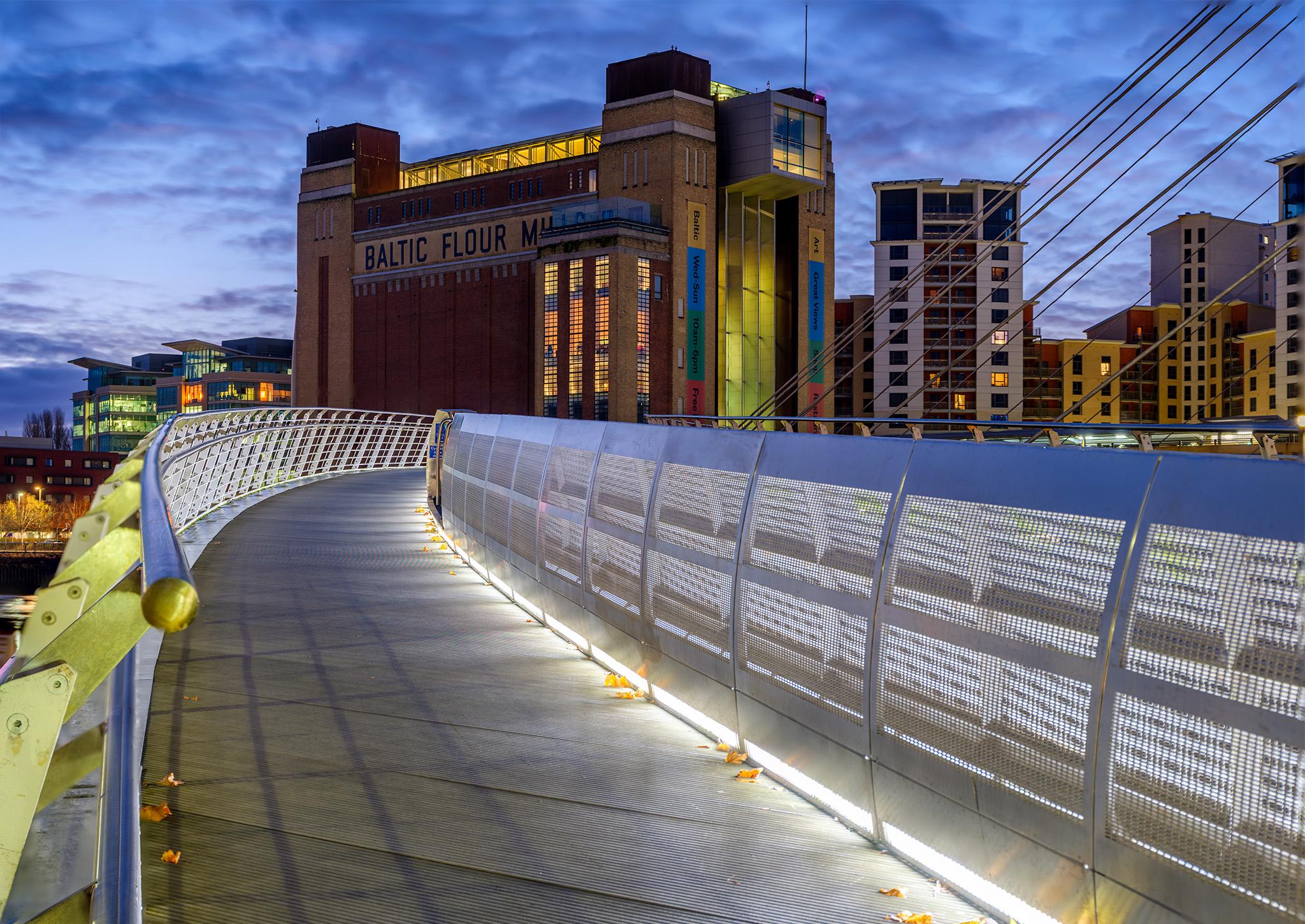 Baltic Centre and Millenium Bridge in Gateshead England during the morning blue hour