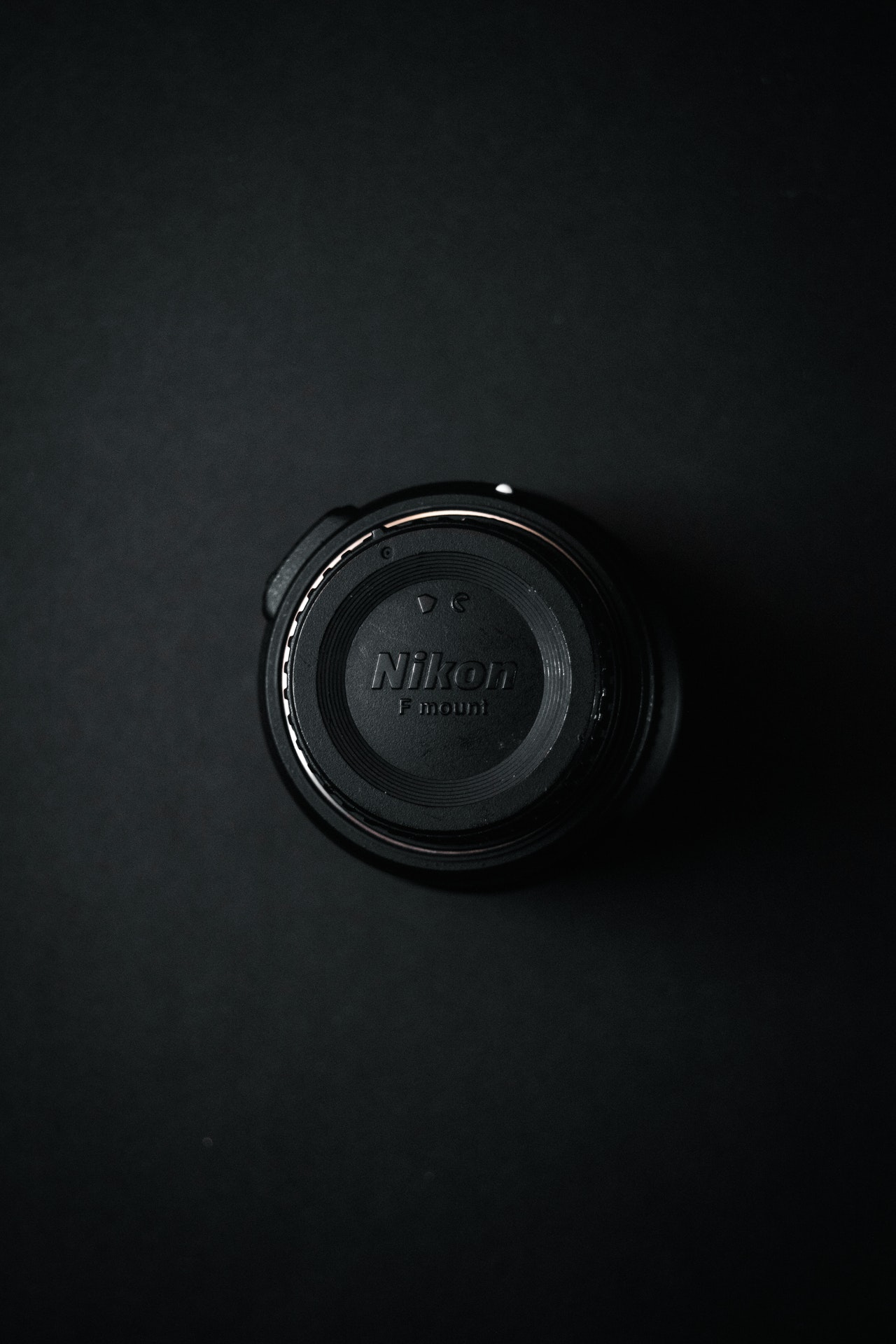 black nikon camera lens