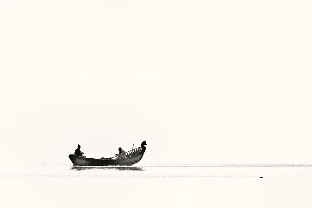 River with boat in black and white