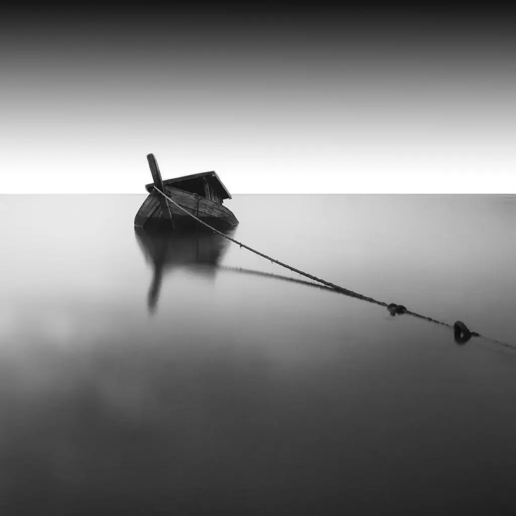 River with boat in black and white