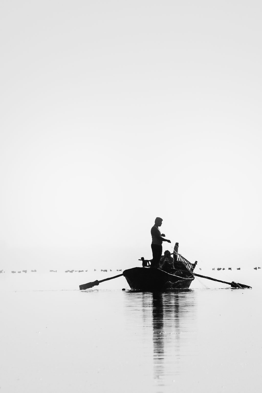 River with fisherman in black and white 