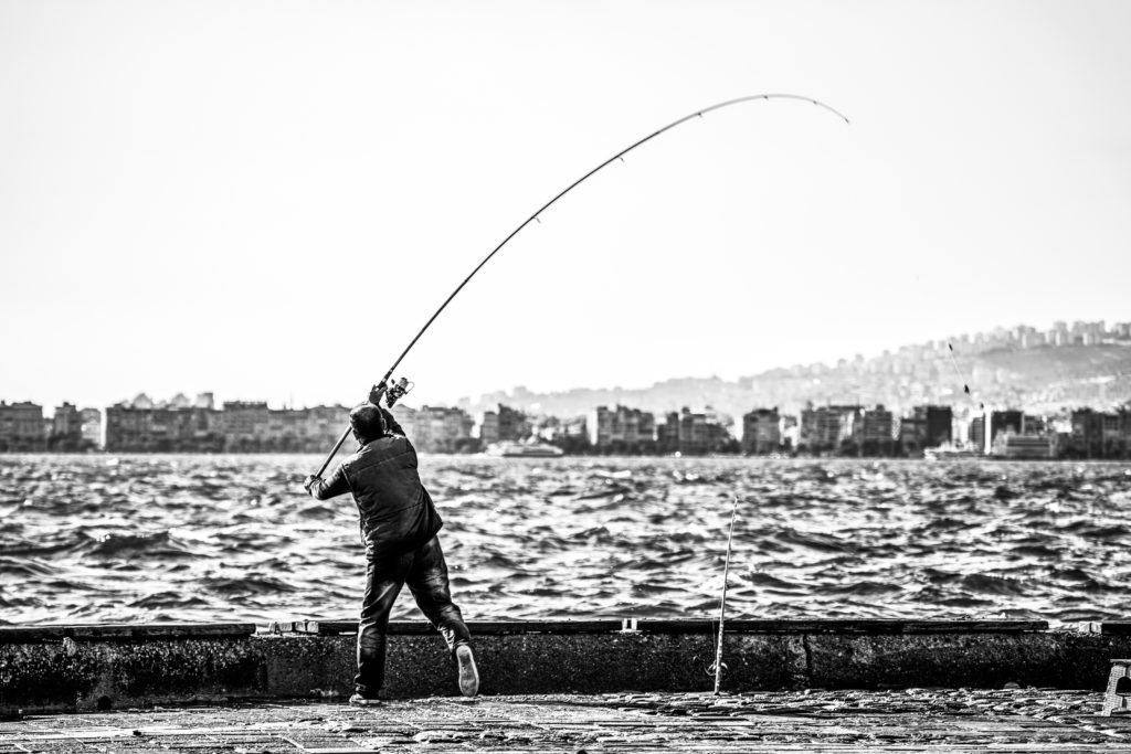 River with fisherman in black and white 