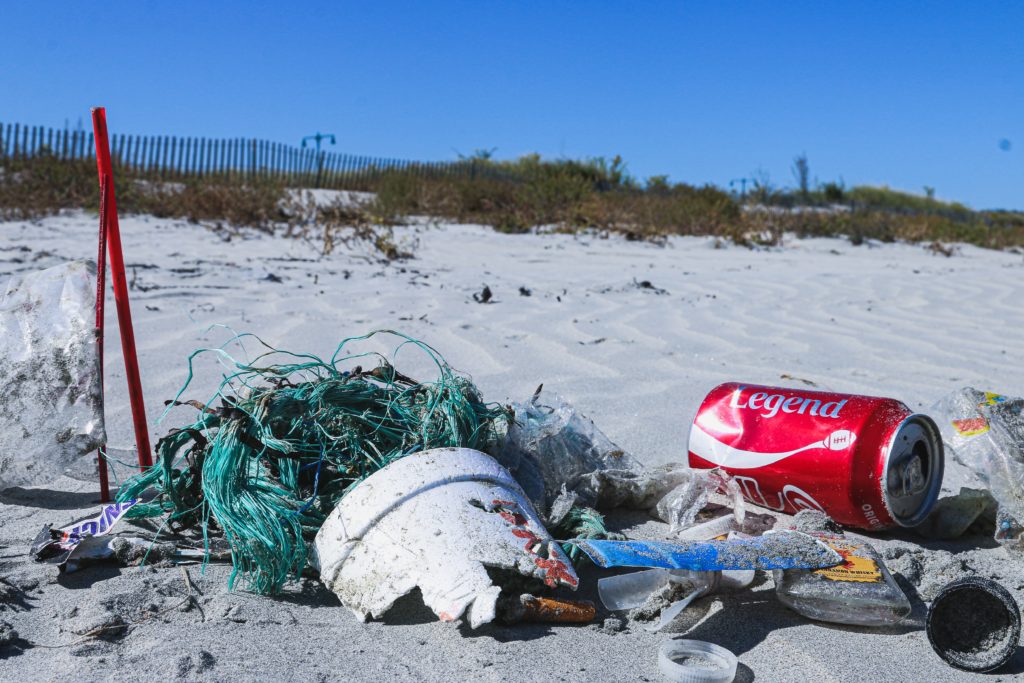 Garbage on a sandy beach photographic burnout