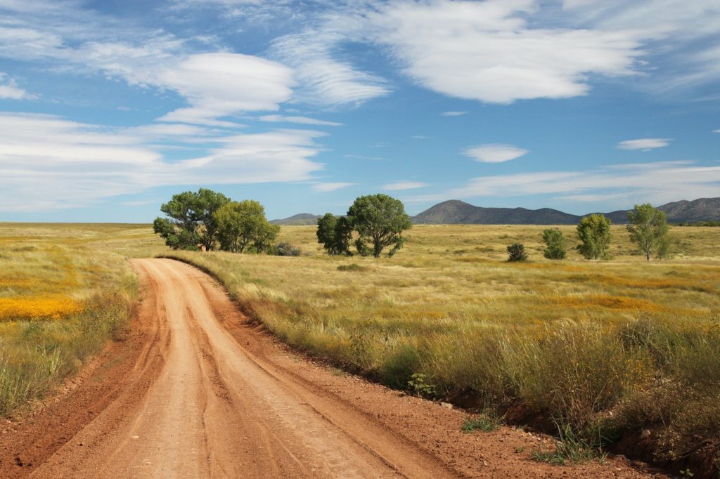 brown road going to the mountain photography