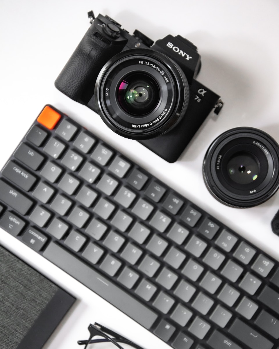 black canon dslr camera on white table