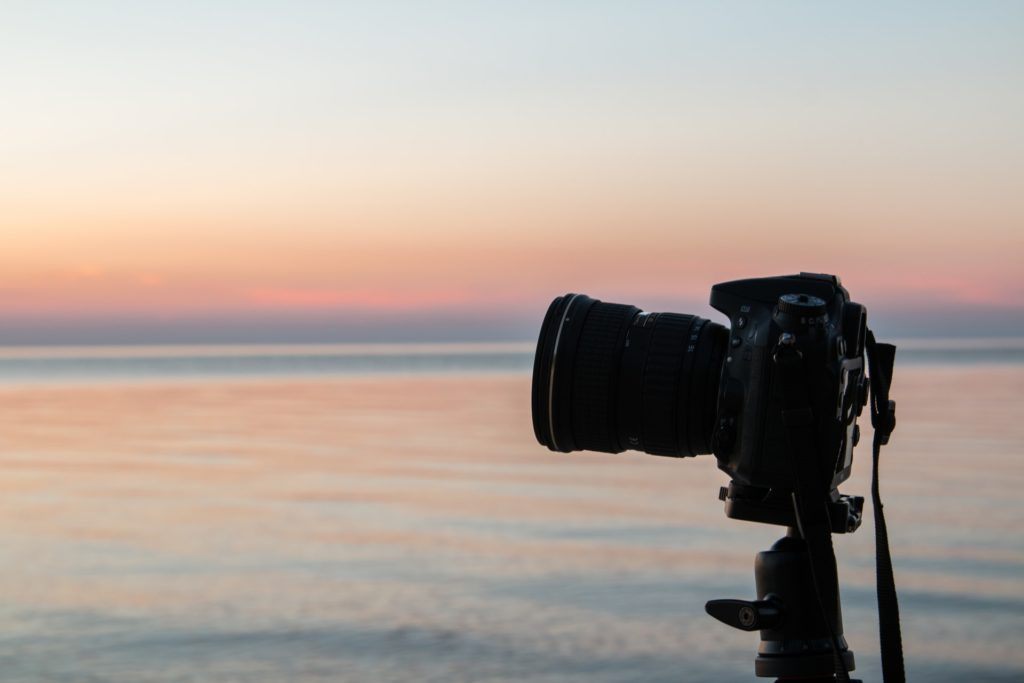 camera on tripod at the sea