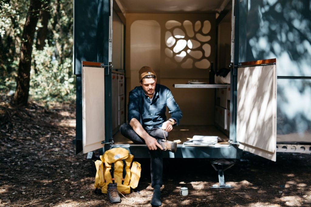 photographer camping and getting ready to take shots with his smartphone