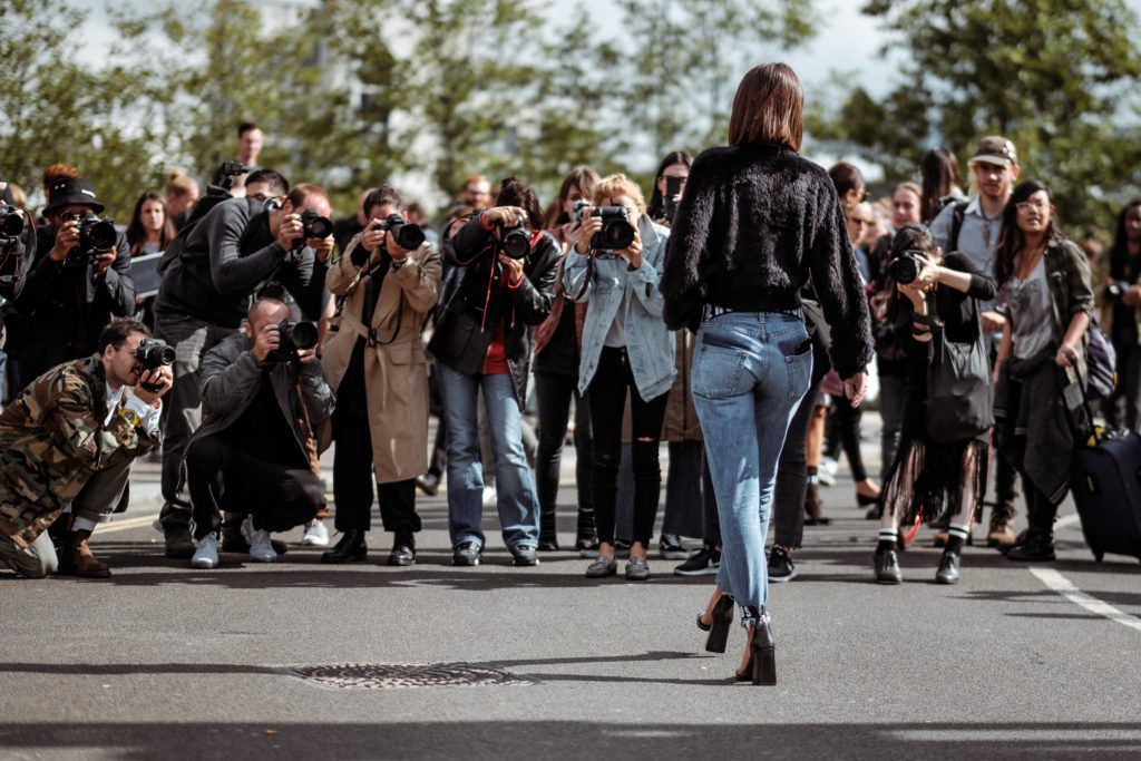 Photographers taking shot of model