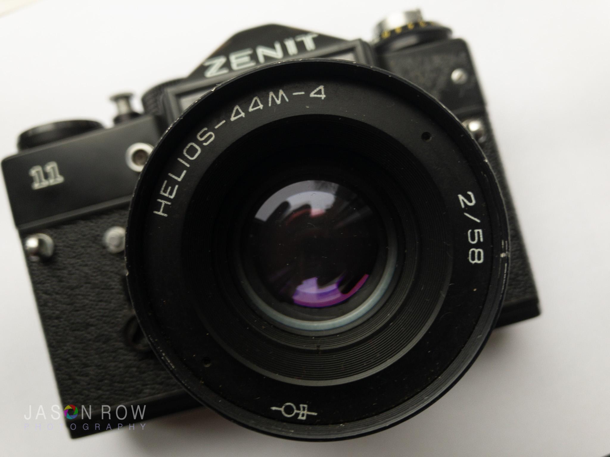 Close front shot of a Zenit 11 with Helios 58mm lens out of a white background