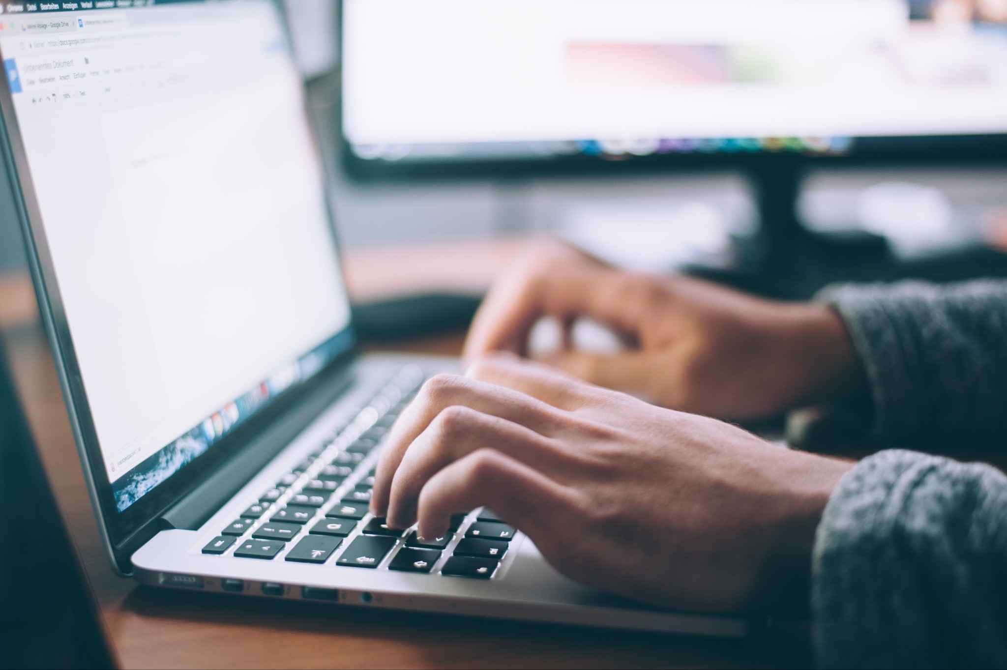 Close shot of hands typing on a laptop 