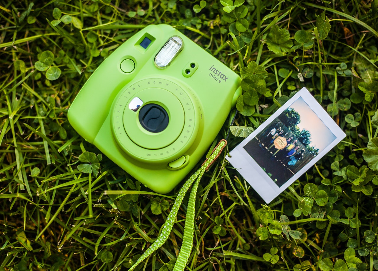 close up photography of camera on grass