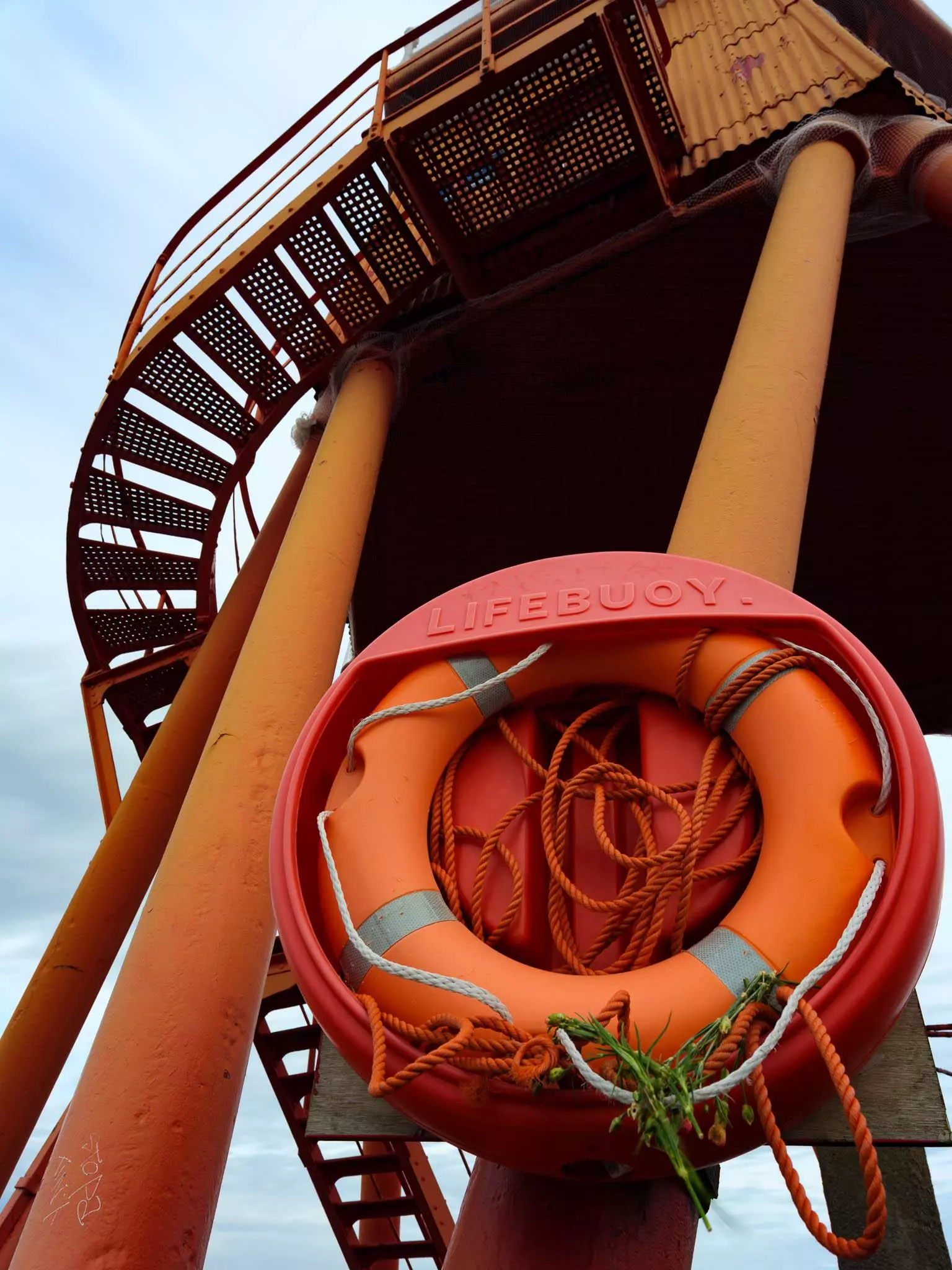 Close up shot of red life ring on Herd Groyne Lighthouse in South Shields
