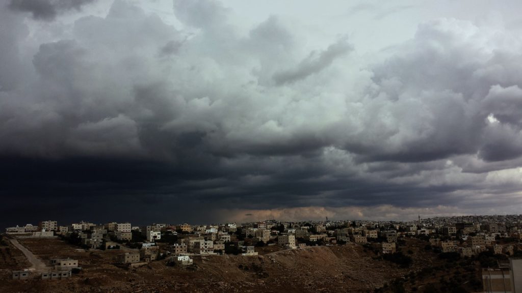 Storm clouds over city.