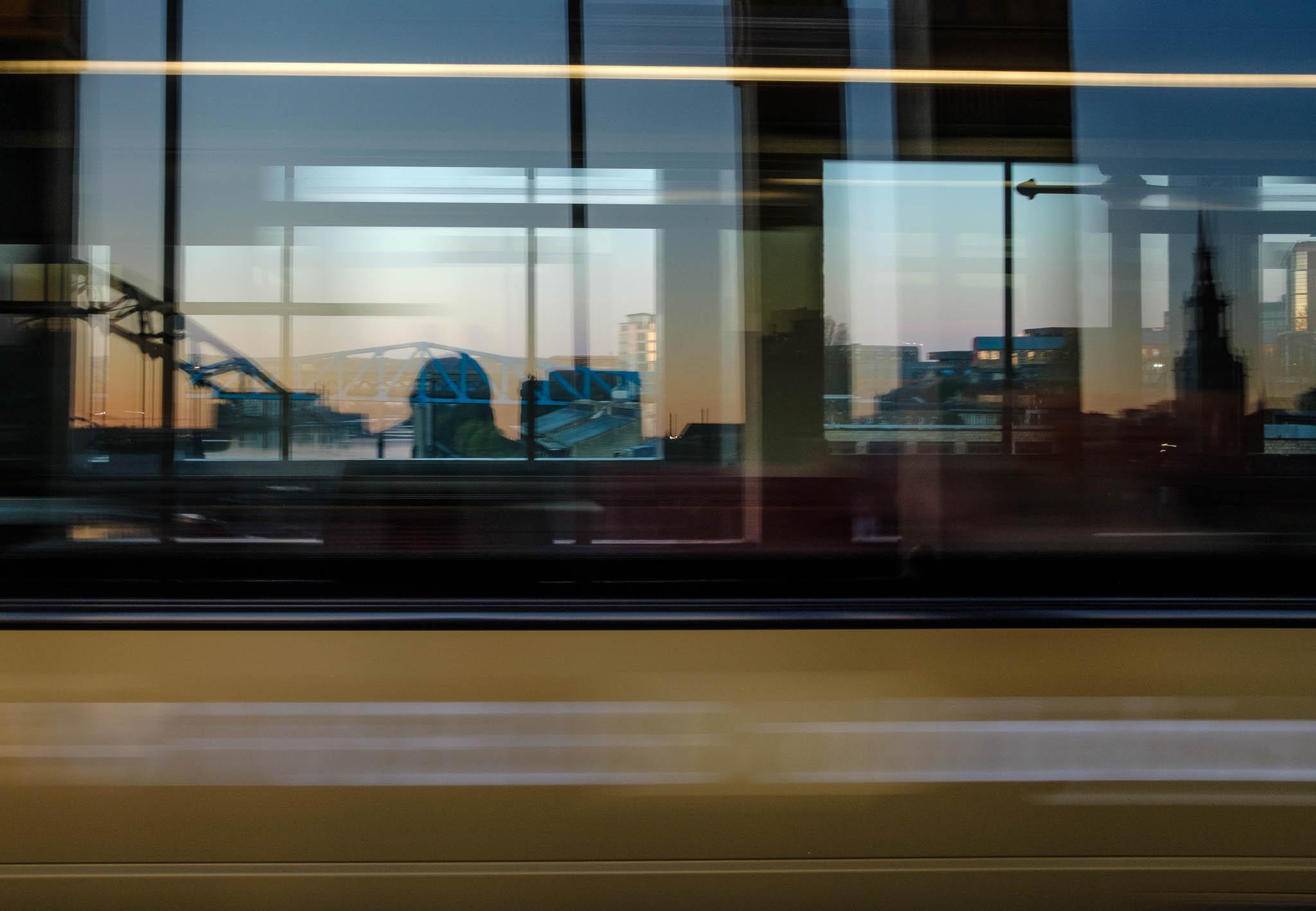 Commuters on bus speed past Tyne Bridges