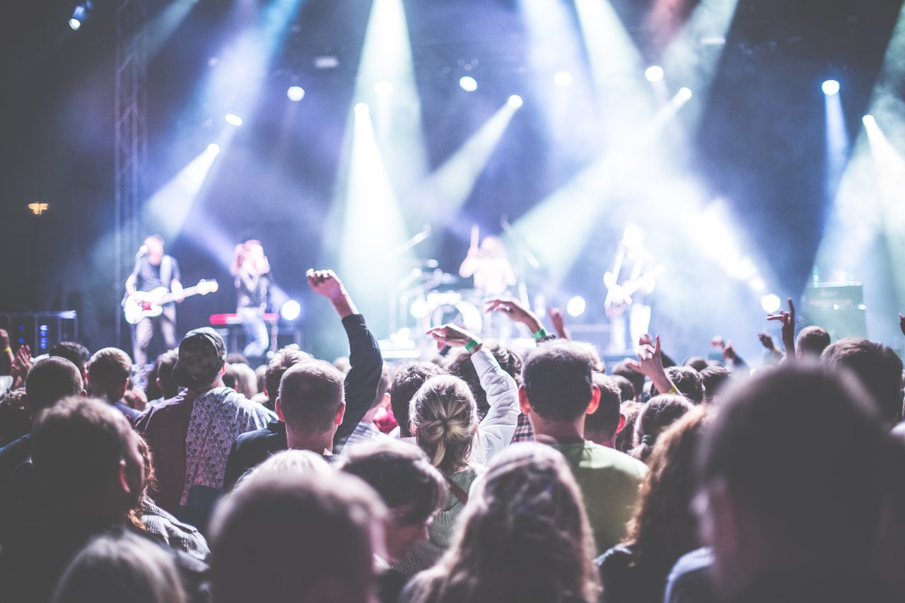 crowd in front of people playing musical instrument during