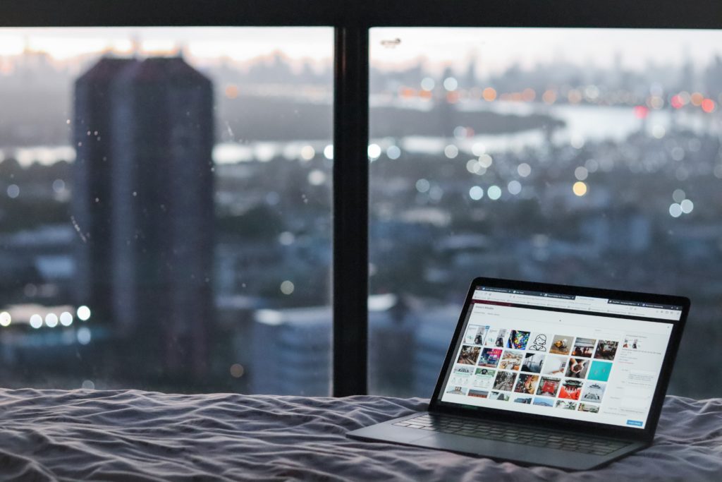 Laptop in hotel room with view