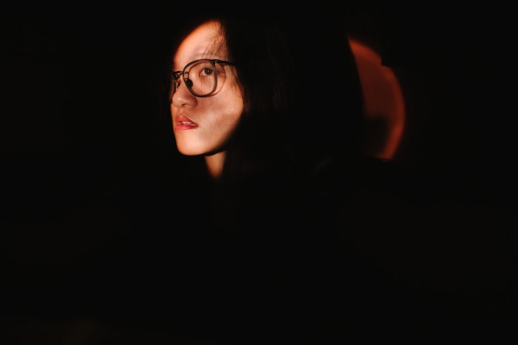 woman in black framed eyeglasses self-portraits