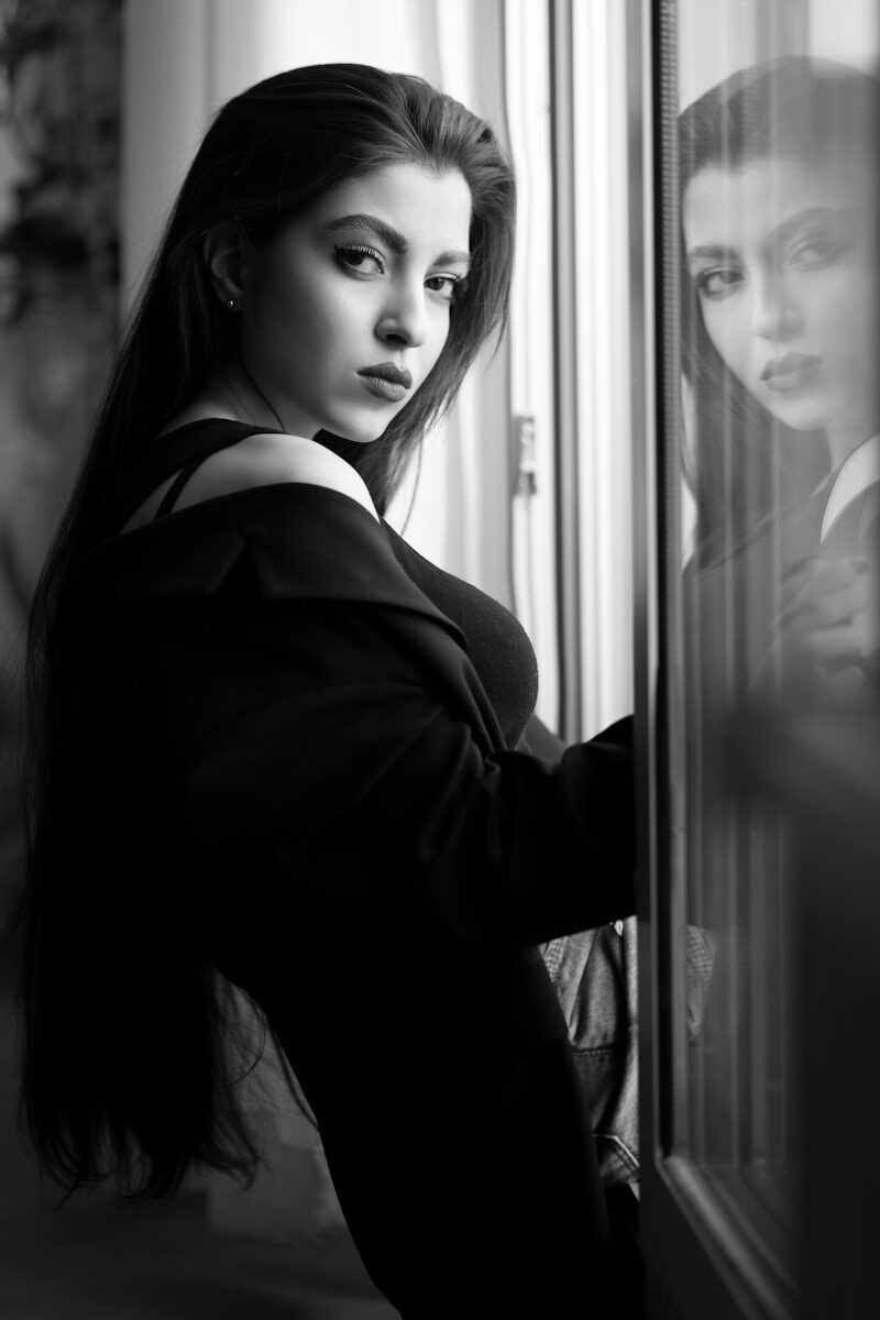 grayscale photo of woman in black long sleeve shirt