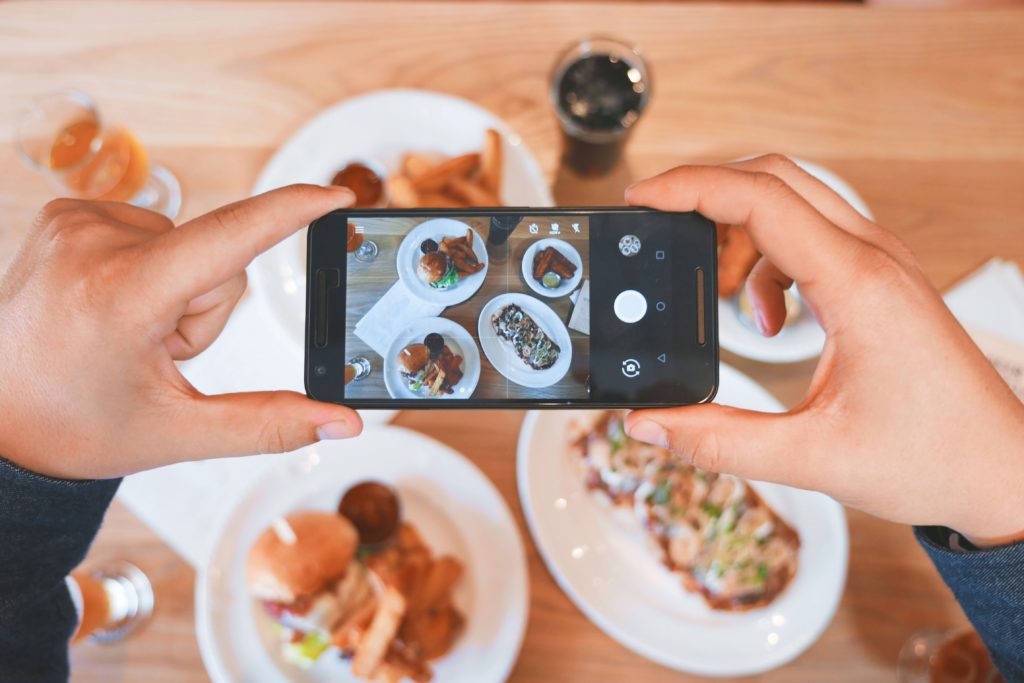 Photo of phone taking photo of dinner