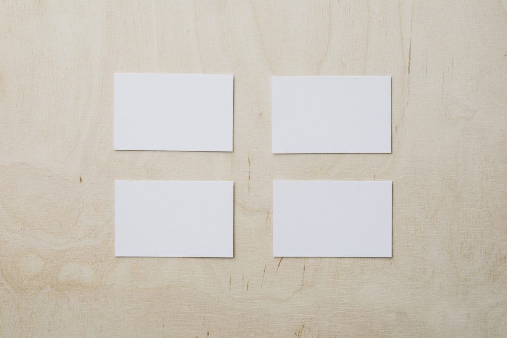 empty white business cards on wooden table