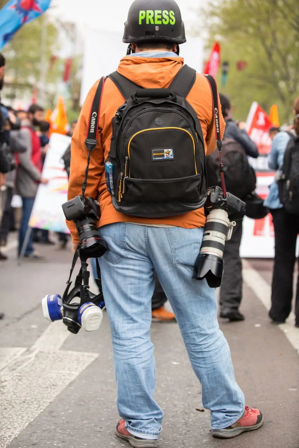 Press photographer with multiple cameras