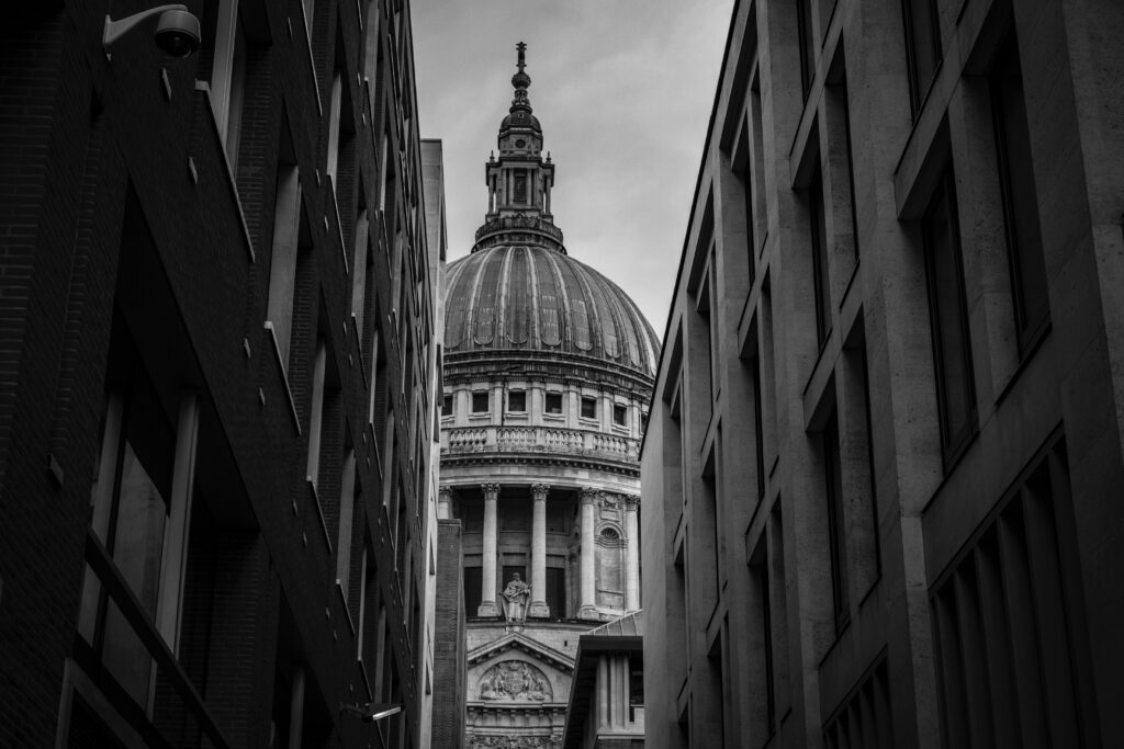 View of St Pauls through an alley in the City of London