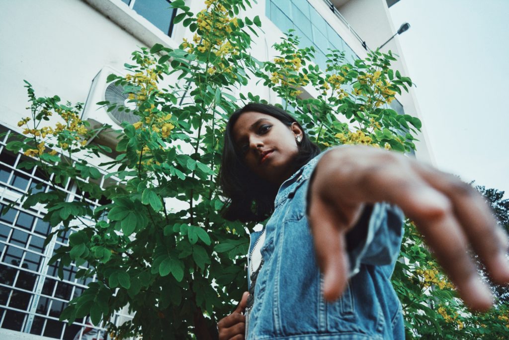 girl wearing blue denim vest