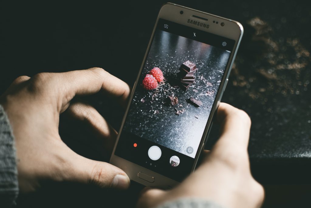 gray samsung smartphone showing chocolates