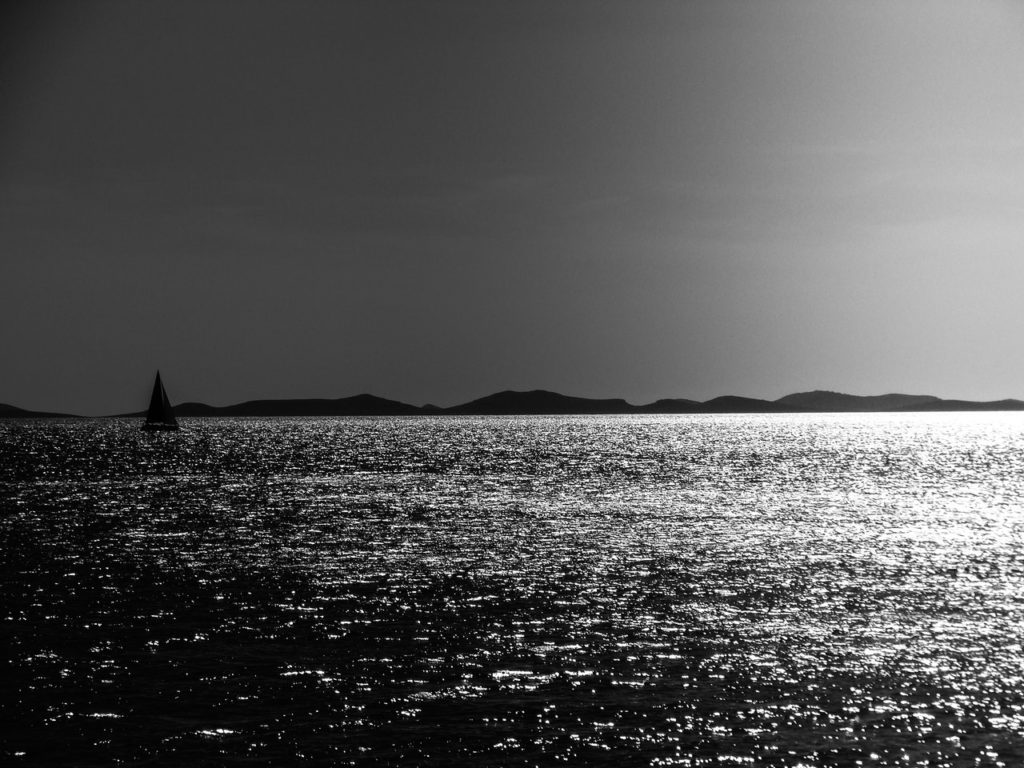 grayscale photo of a body of water