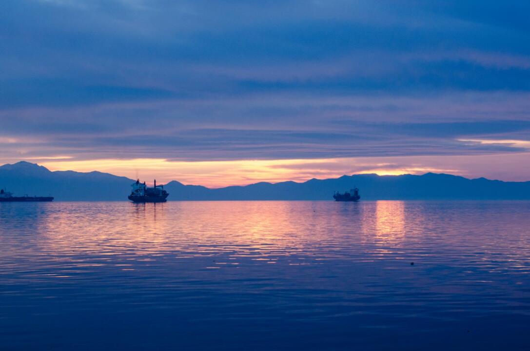 ship on body of water during golden hour