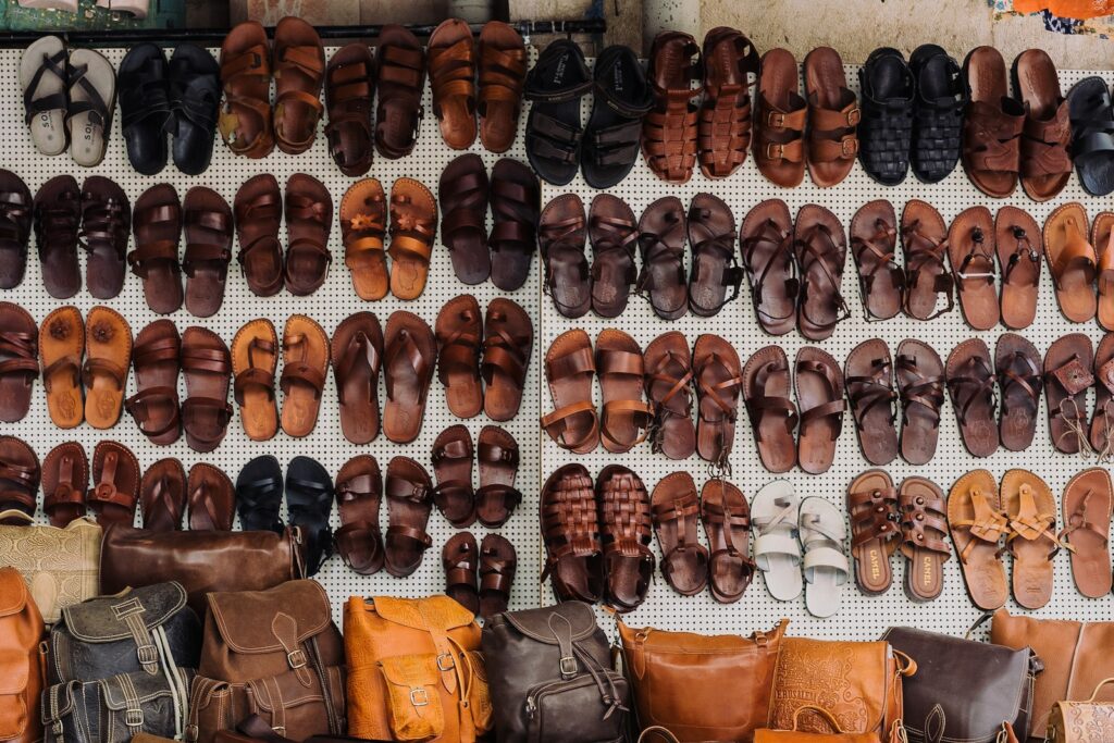 pairs of assorted sandals lot on white textile