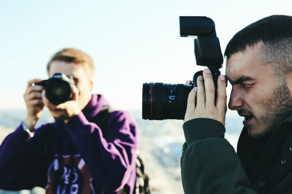 Two photographers shoot in harsh light