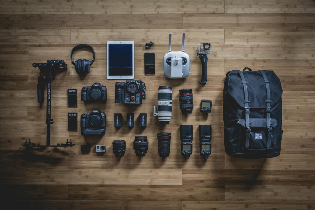Camera gear laid out on wooden floor
