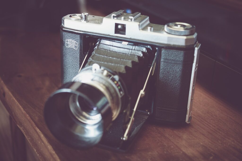 black bridge camera on brown tabletop