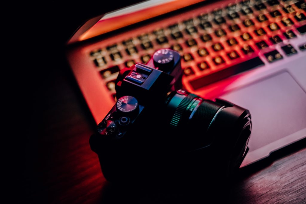 Camera on top of open laptop