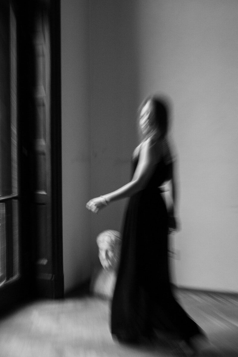 a woman in a long dress is dancing