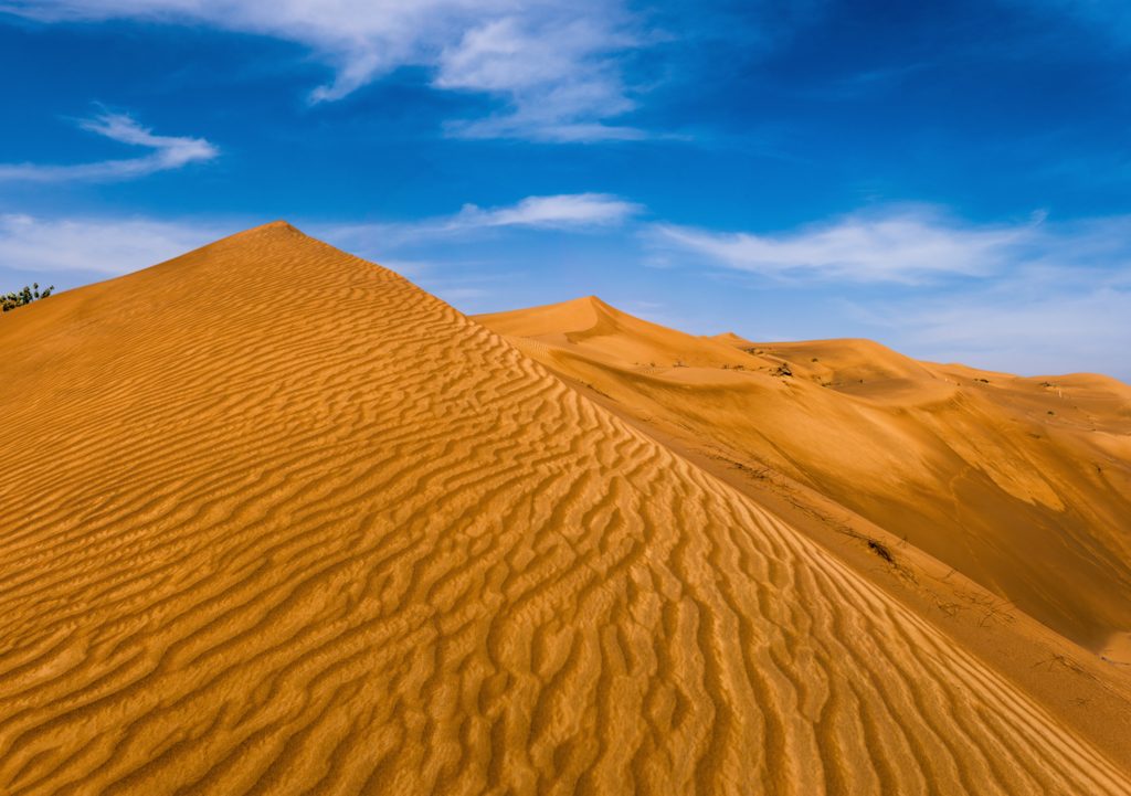 desert with blue sky and clouds