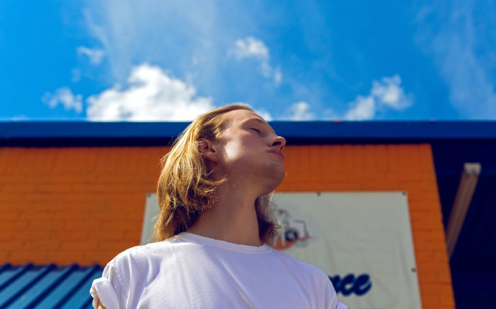 blond haired man fashion shoot urban