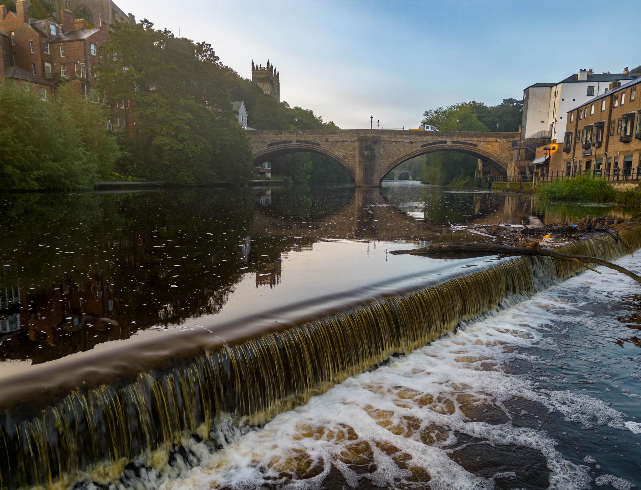 Low level drone shot if a weir in Durham, England