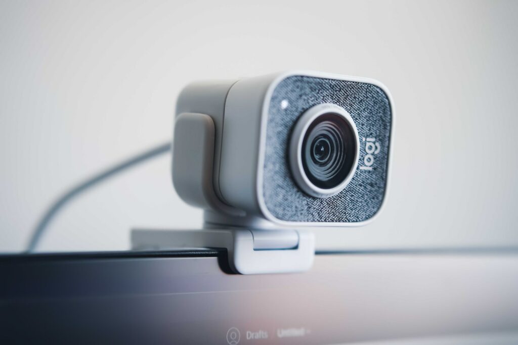 black and silver webcam on white table