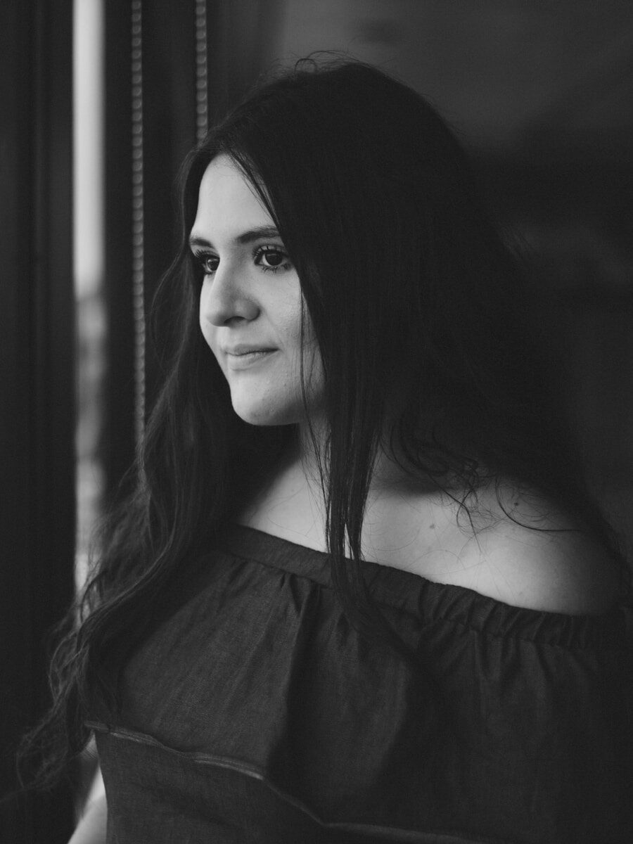 grayscale photo of woman in off shoulder top