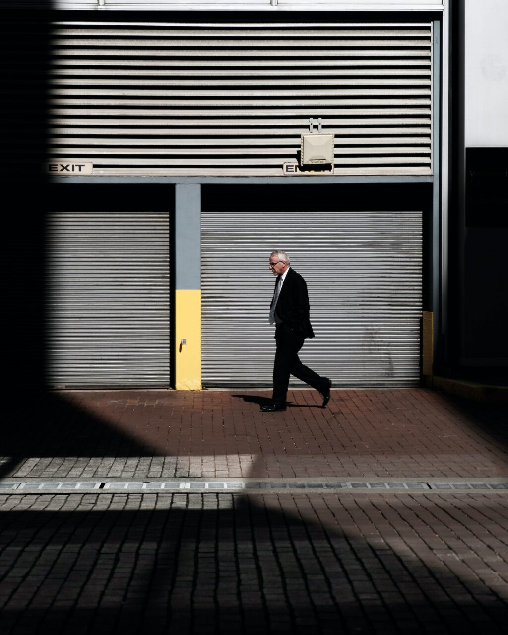 man walking empty street