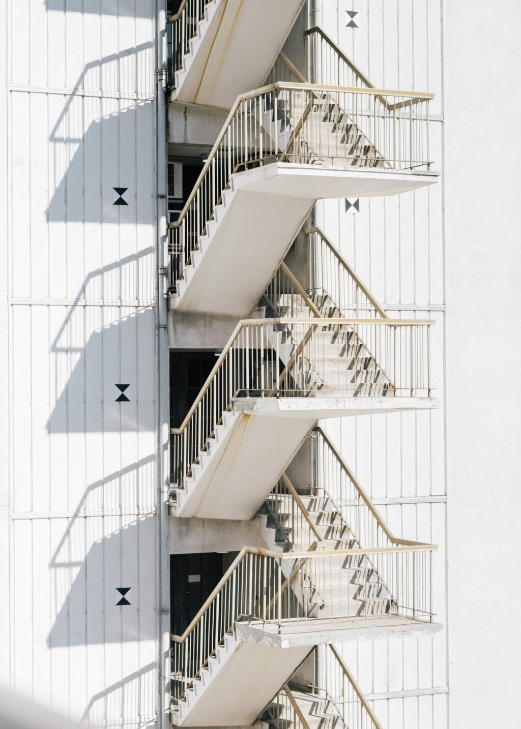 modern staircase of white building in sunlight