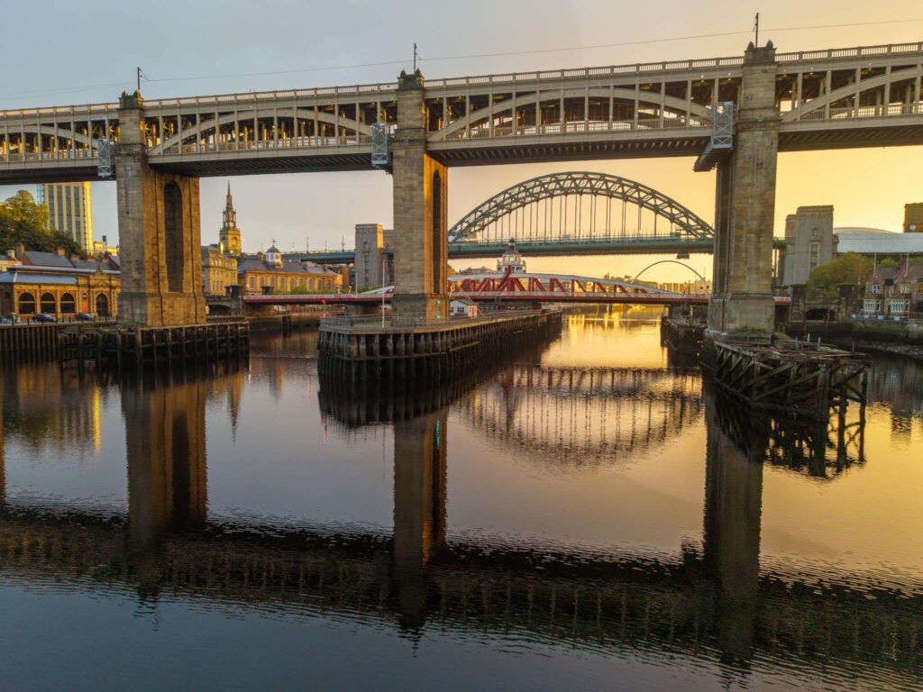 Morning golden hour drone shot of the Tyne Bridges in Newcastle