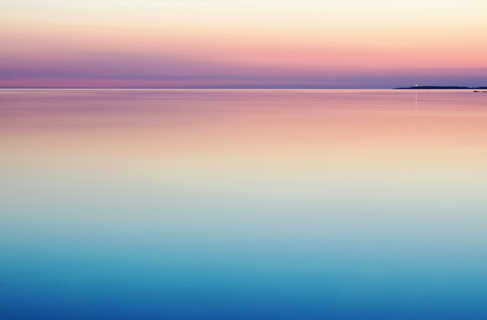 photo of abstract blue and pink sea