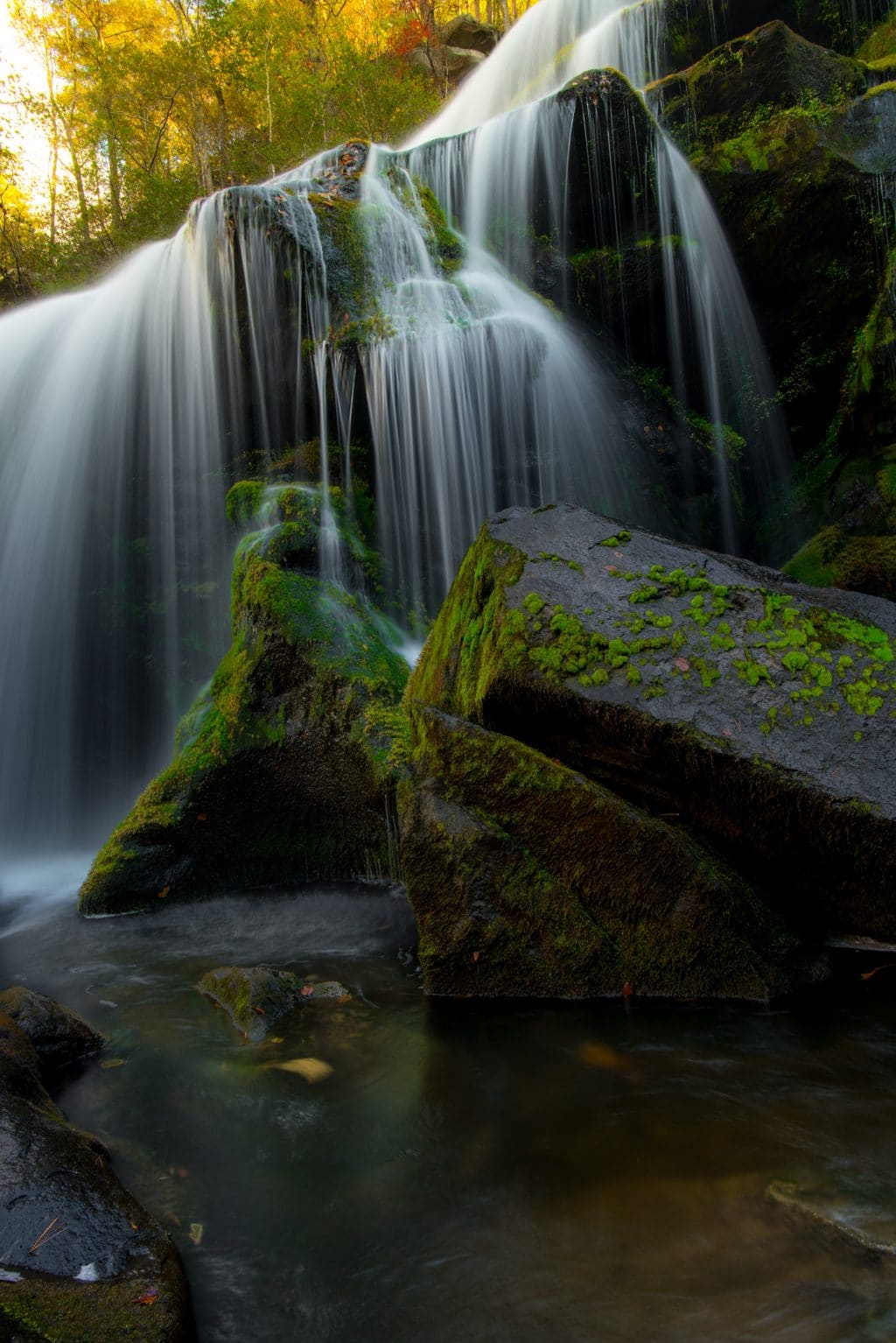 Waterfall over mossy rocks