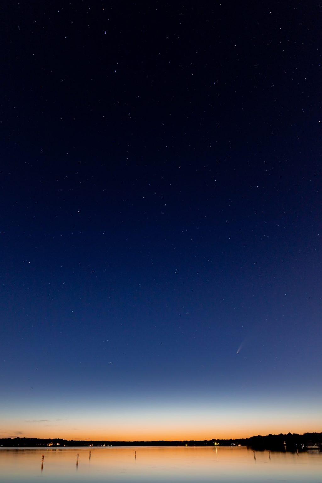 Neowise over body of water