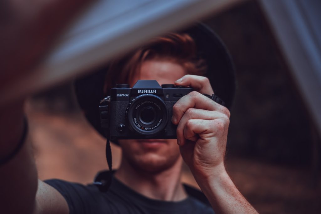 selective focus photo of black camera self-portraits