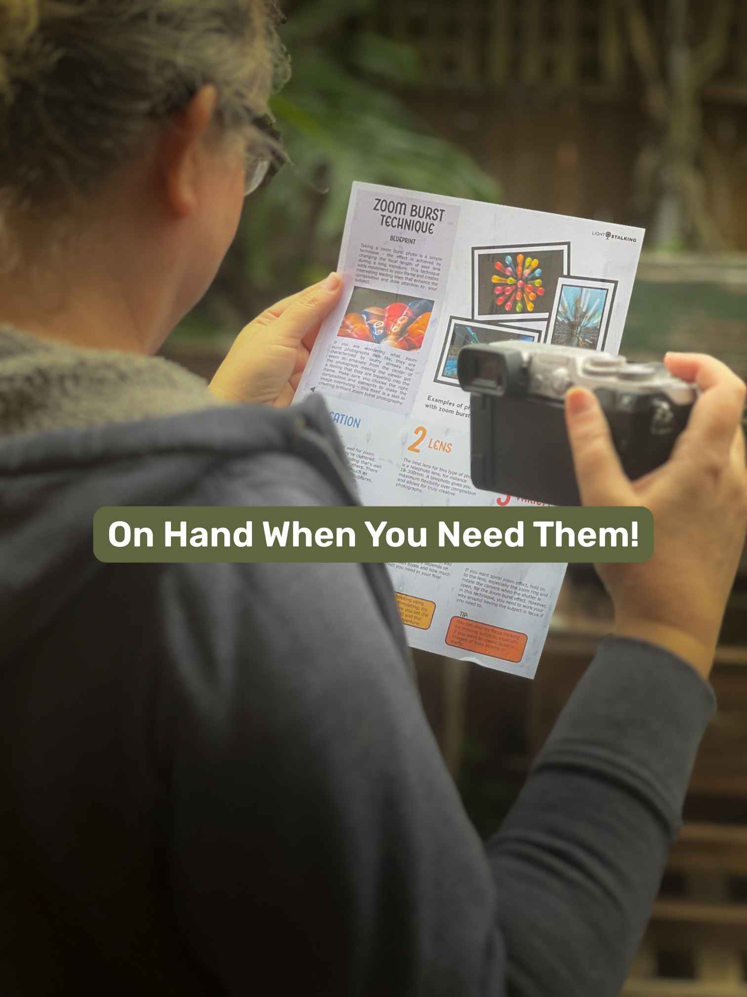 Photographer holding a printed Zoom Burst Blueprint beside a camera